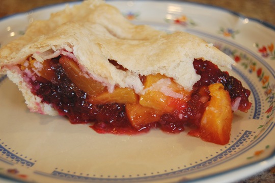 peach and blackberry pie slice