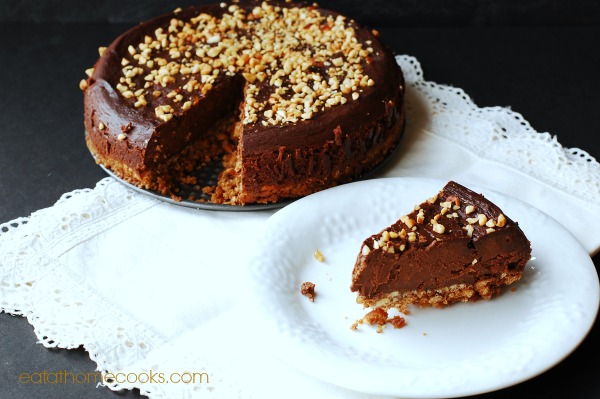 Slow Cooker Chocolate Cheesecake with Pretzel Crust and Nut Topping