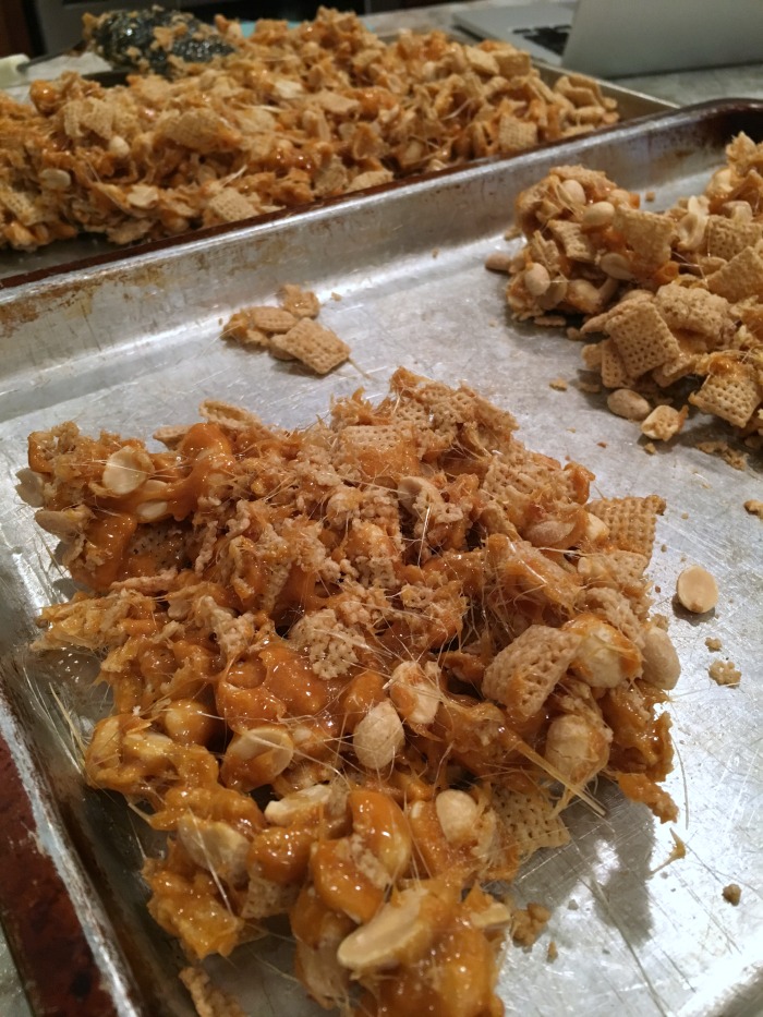 peanut-brittle-chex-mix-on-pans